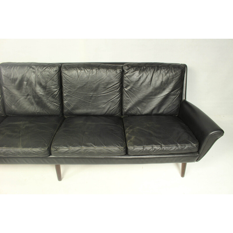 Vintage 4-seater sofa in black leather