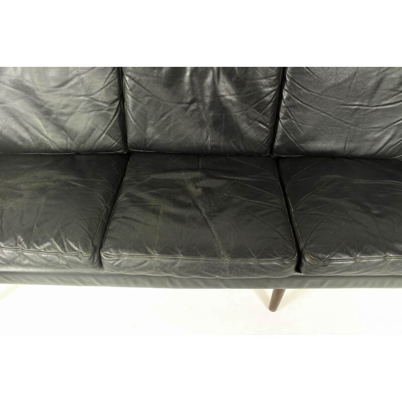 Vintage 4-seater sofa in black leather