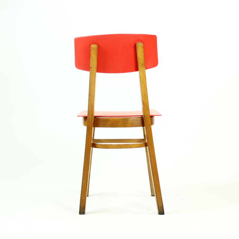 Vintage red chair in plastic and beechwood