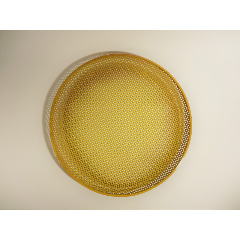 Vintage yellow tray in perforated metal