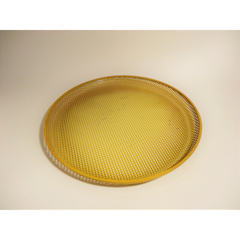 Vintage yellow tray in perforated metal