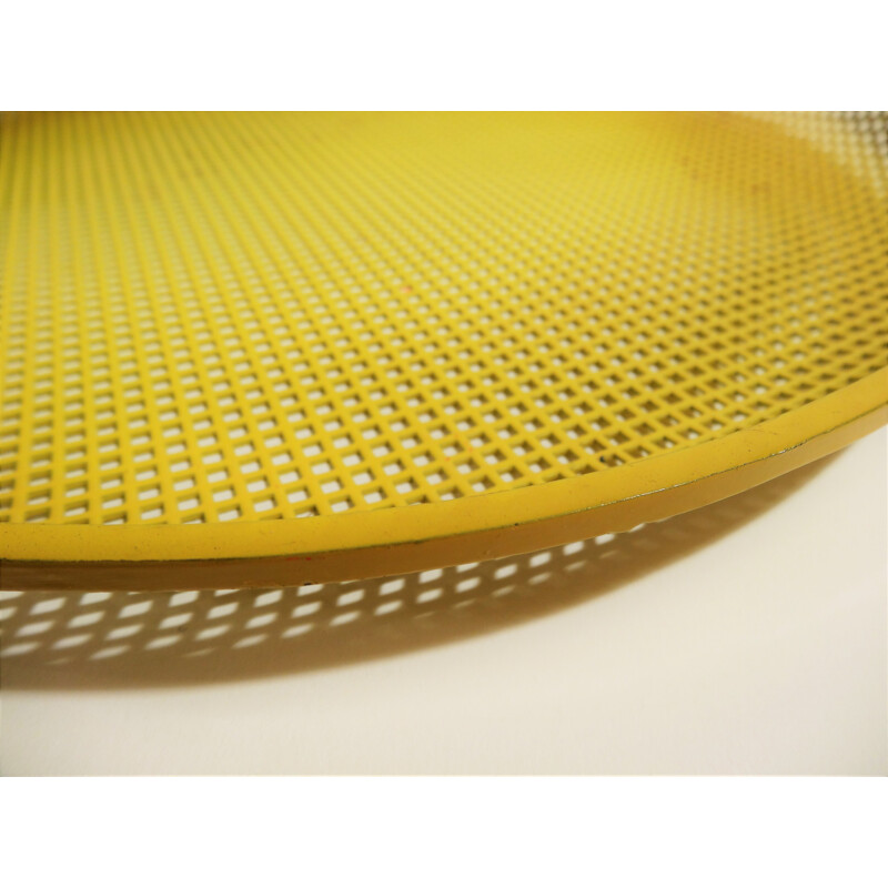 Vintage yellow tray in perforated metal