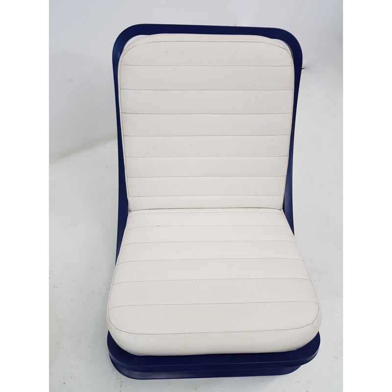 Pair of white lounge chairs in leatherette