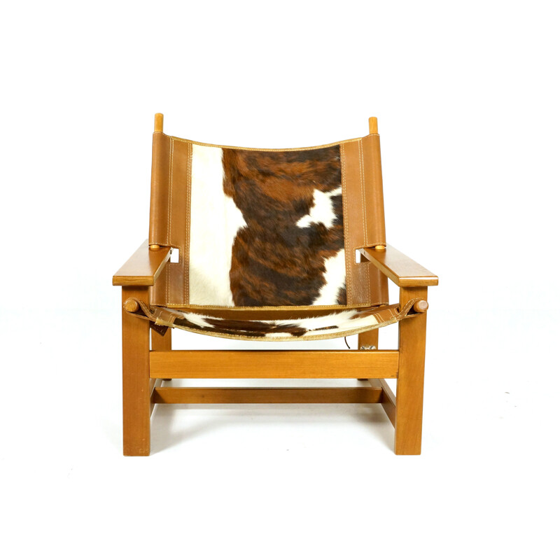 Vintage easy chair in teak and cowhide - 1970s