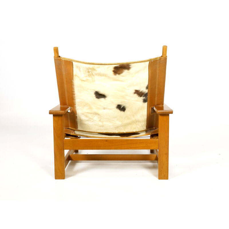 Vintage easy chair in teak and cowhide - 1970s