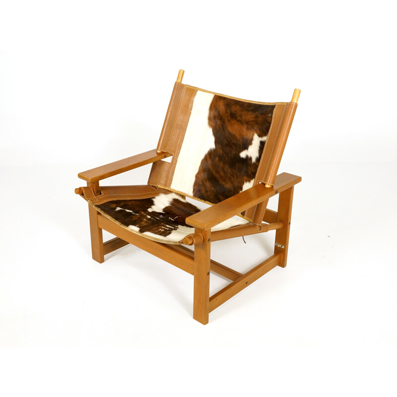 Vintage easy chair in teak and cowhide - 1970s