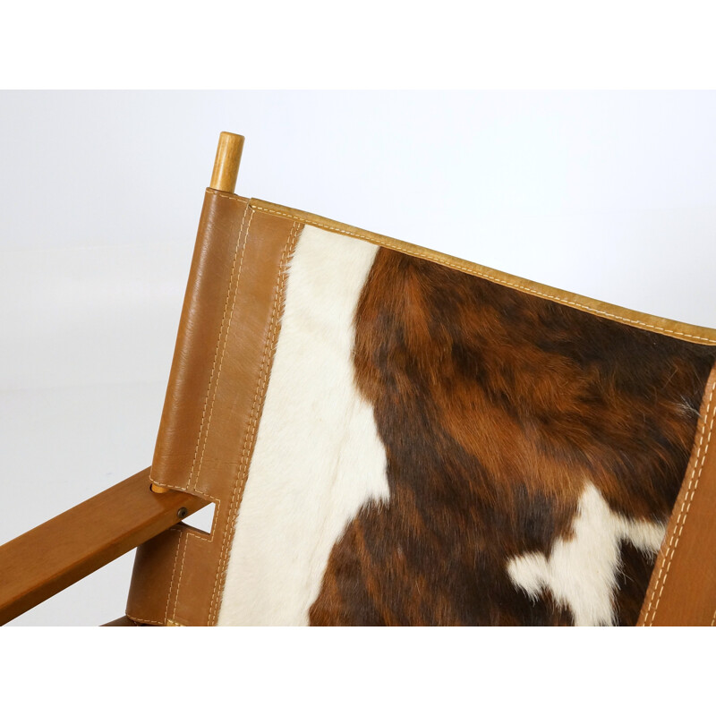 Vintage easy chair in teak and cowhide - 1970s