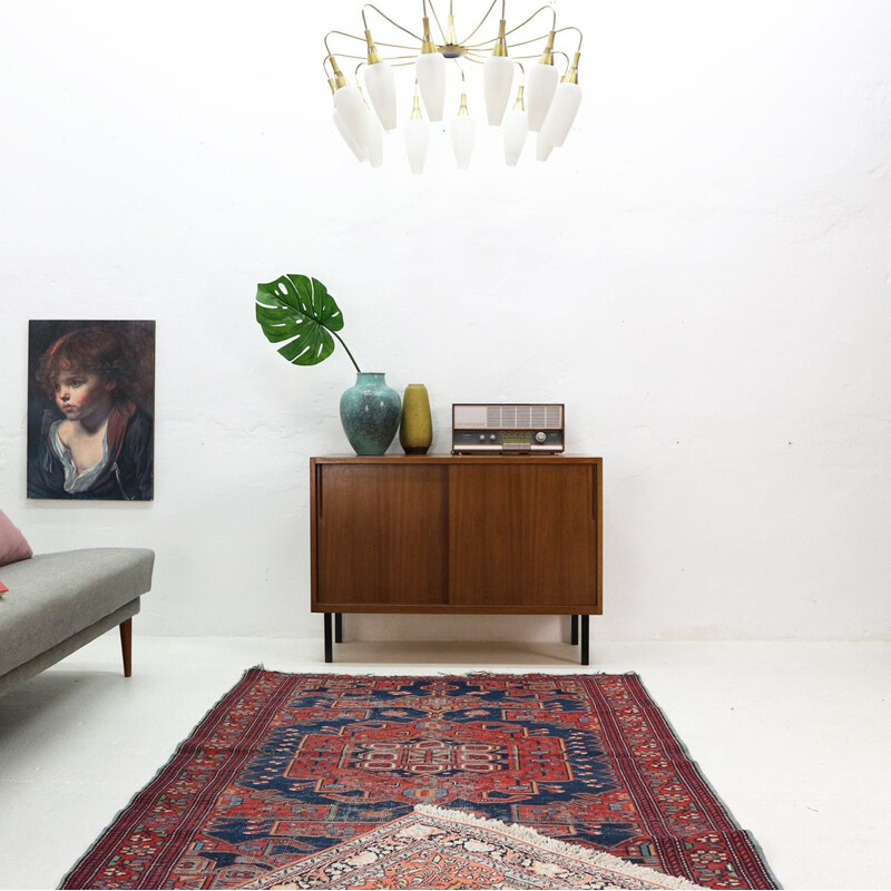 Vintage chandelier in brass and white glass