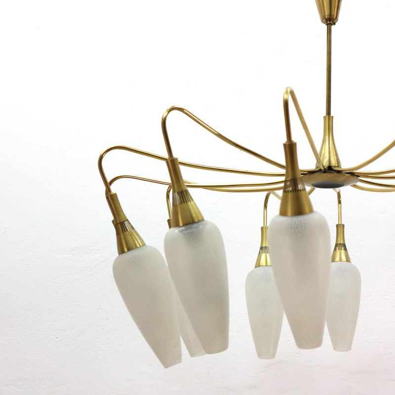 Vintage chandelier in brass and white glass