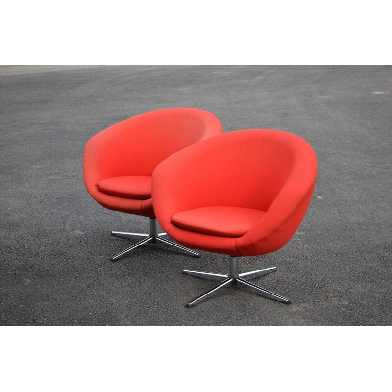 Pair of red swiveling armchairs by Carl Eric Klote