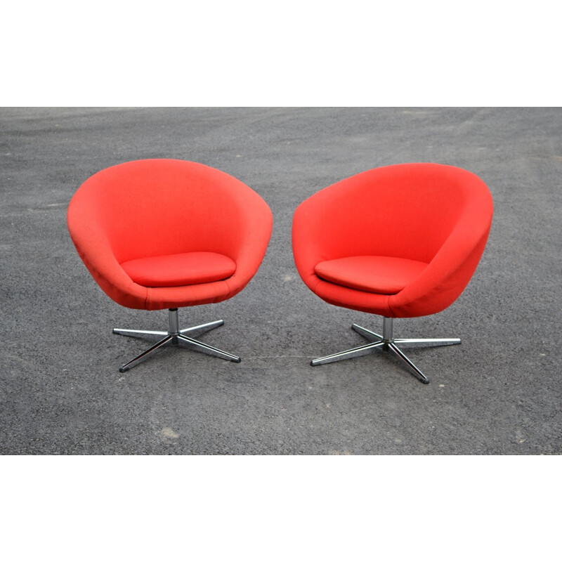 Pair of red swiveling armchairs by Carl Eric Klote