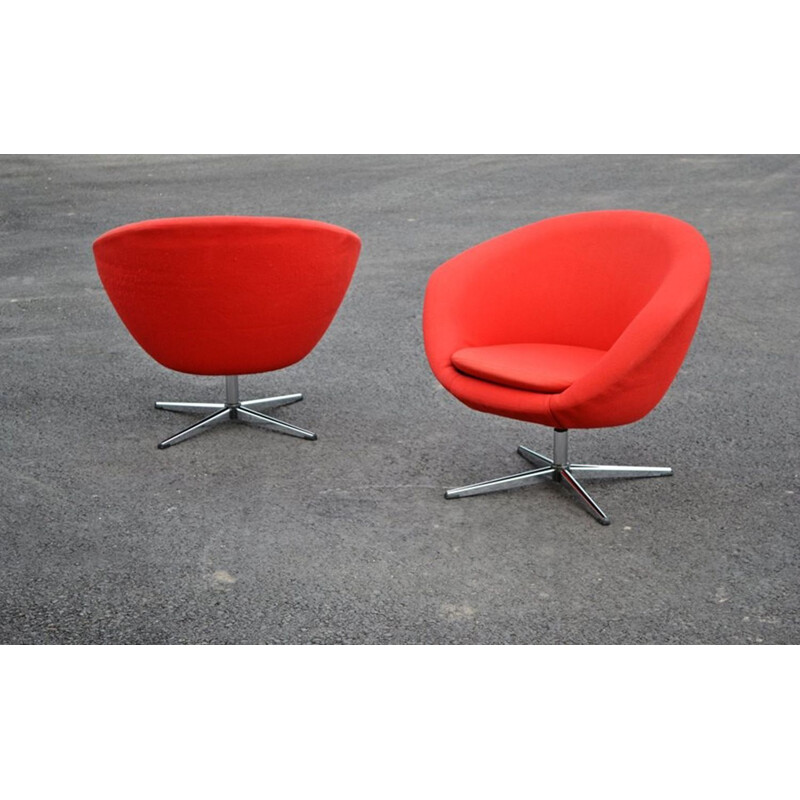 Pair of red swiveling armchairs by Carl Eric Klote