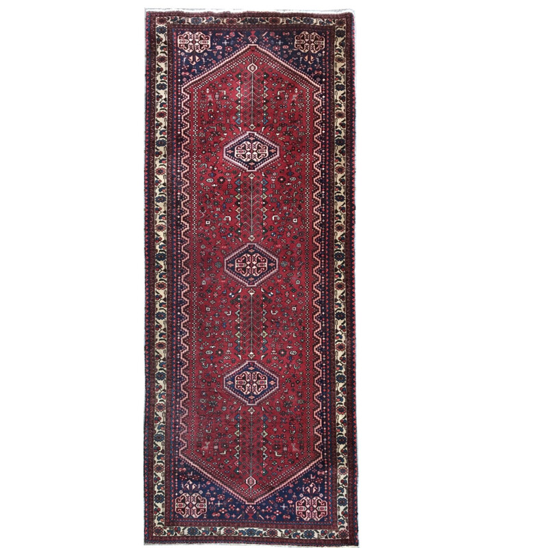 Red Persian carpet in wool