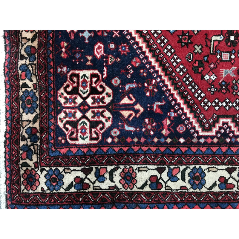 Red Persian carpet in wool