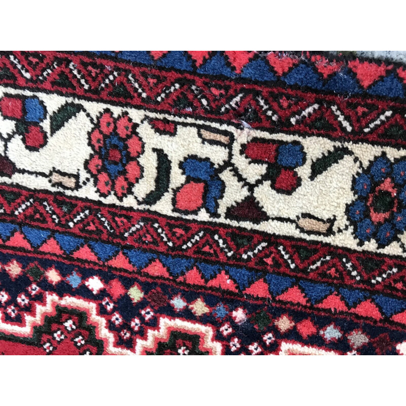 Red Persian carpet in wool