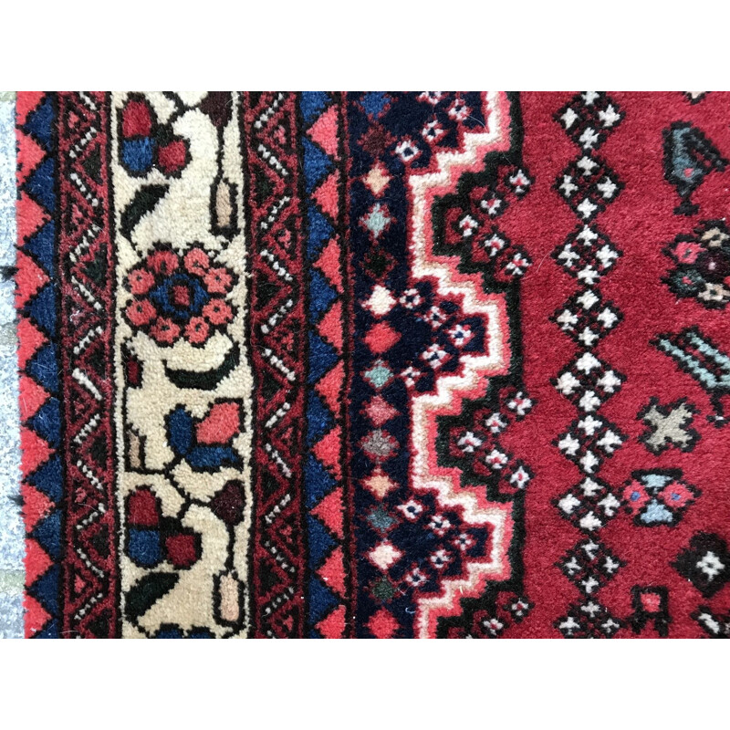 Tapis perse rouge en laine