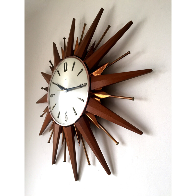 Metamec sunburst wall clock in teak and brass - 1960s