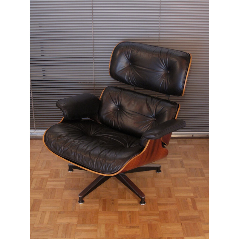 Vintage armchair in black leather and rosewood by Eames