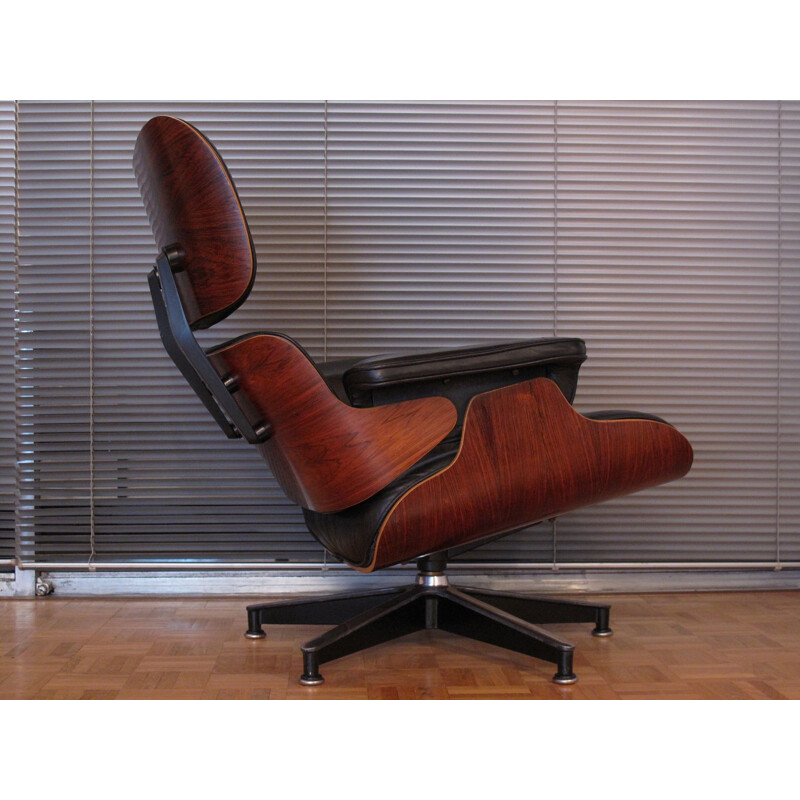 Vintage armchair in black leather and rosewood by Eames