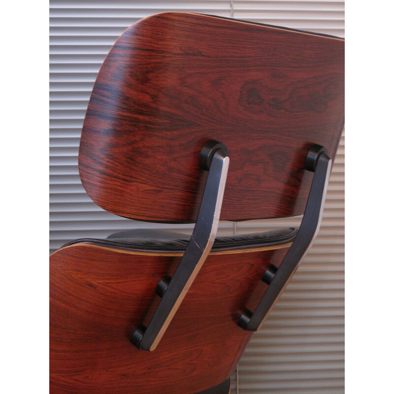 Vintage armchair in black leather and rosewood by Eames