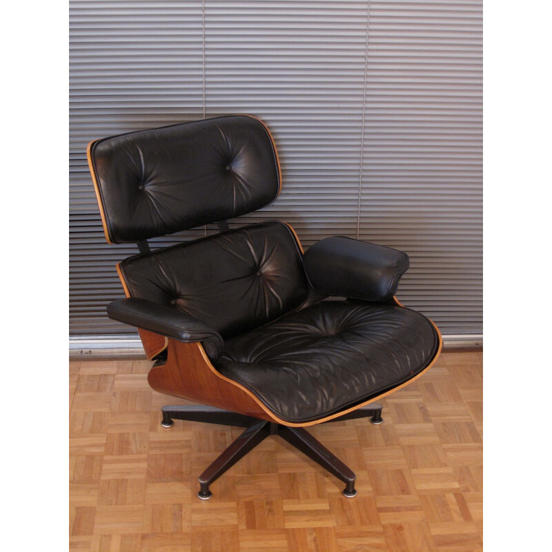 Vintage armchair in black leather and rosewood by Eames