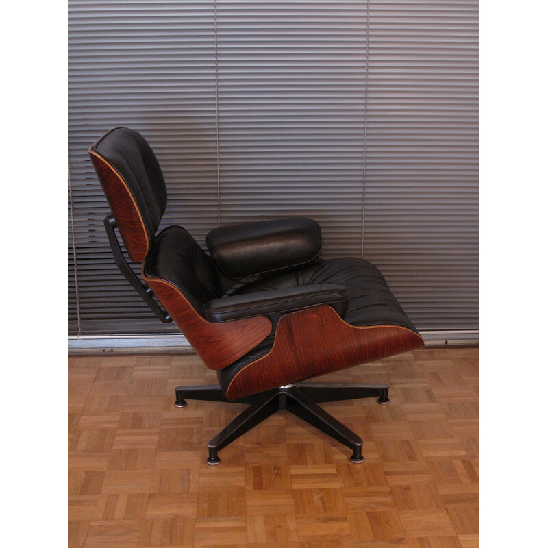 Vintage armchair in black leather and rosewood by Eames