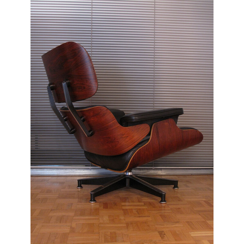 Vintage armchair in black leather and rosewood by Eames