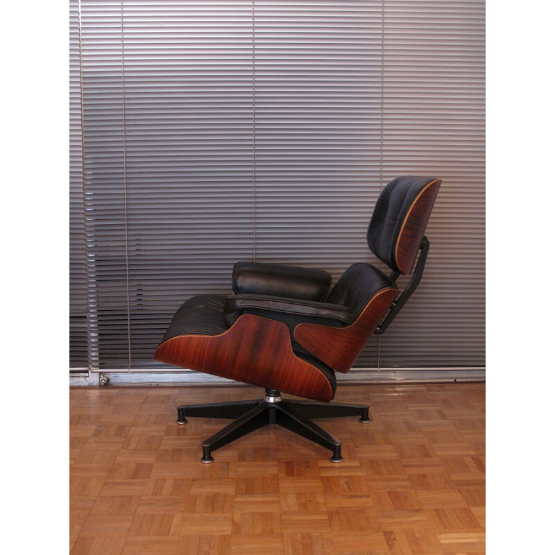 Vintage armchair in black leather and rosewood by Eames