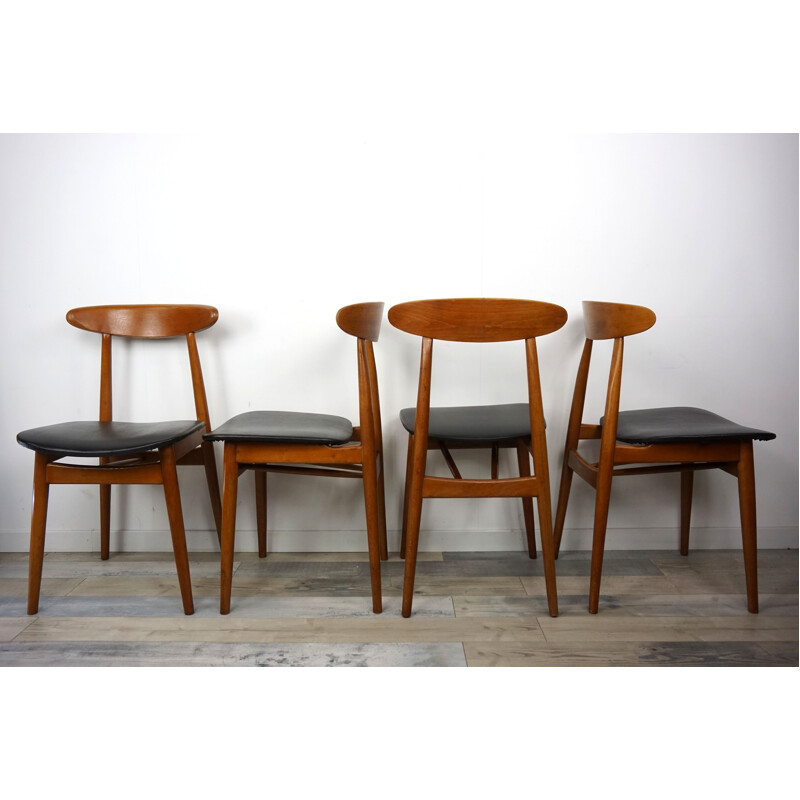 Set of 4 vintage chairs in teak and black leatherette