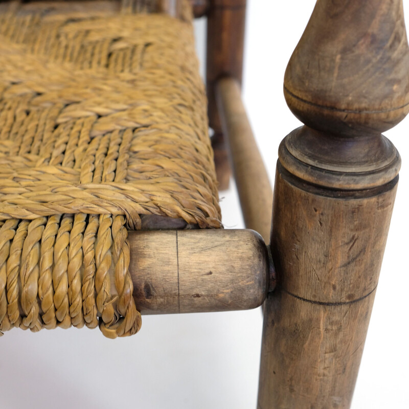 Vintage wooden low armchair in rope