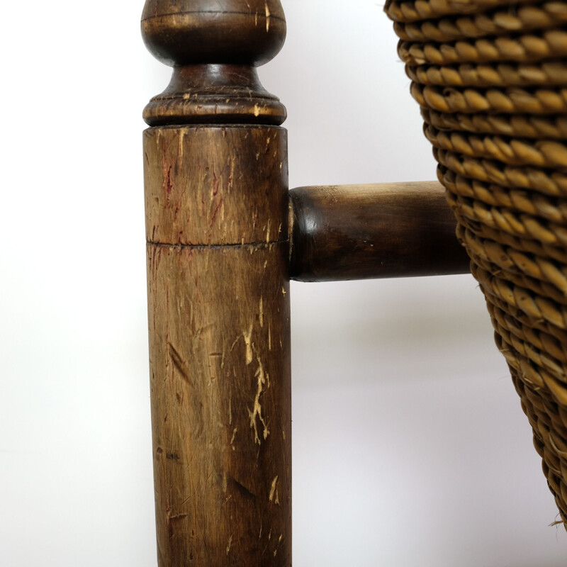 Vintage wooden low armchair in rope