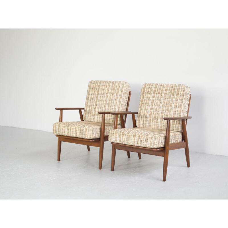 Set of 2 vintage Danish armchairs in solid teak