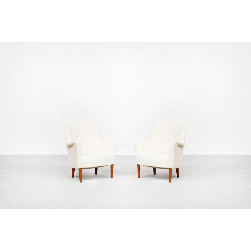 Paire de fauteuils vintage en bois de hêtre
