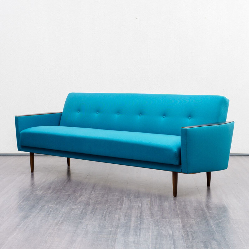 Vintage sofa with fold out bed in petrol blue