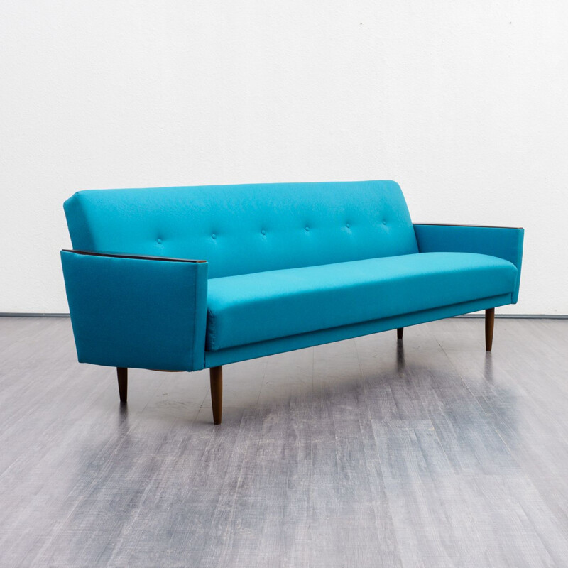 Vintage sofa with fold out bed in petrol blue