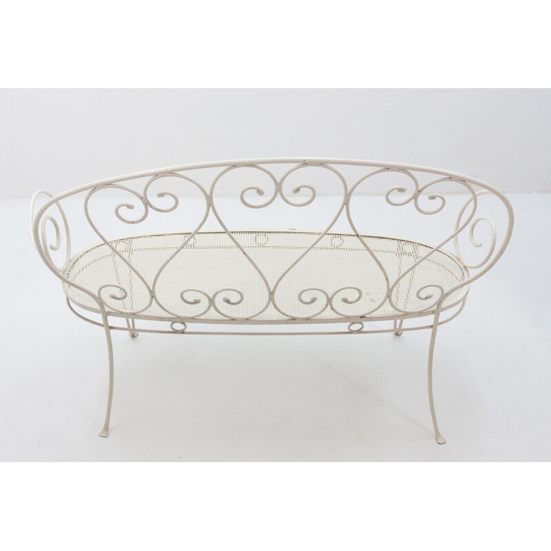 Vintage white garden bench in metal