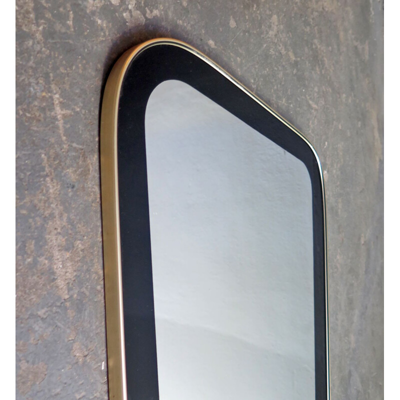 Vintage mirror with black frame and golden edge