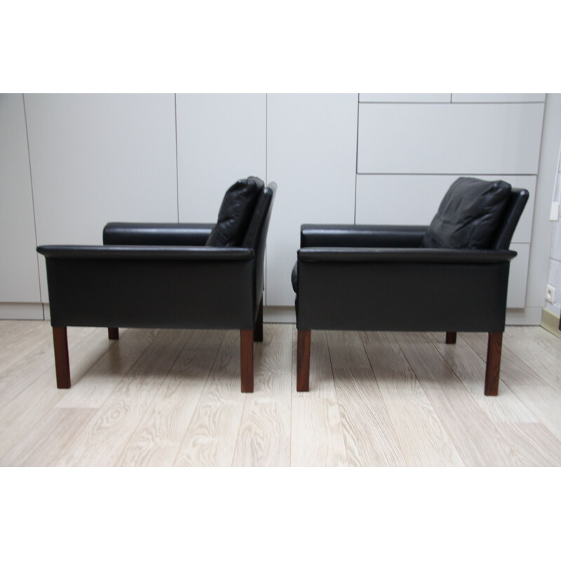 Pair of black leather Club armchairs by Hans Olsen