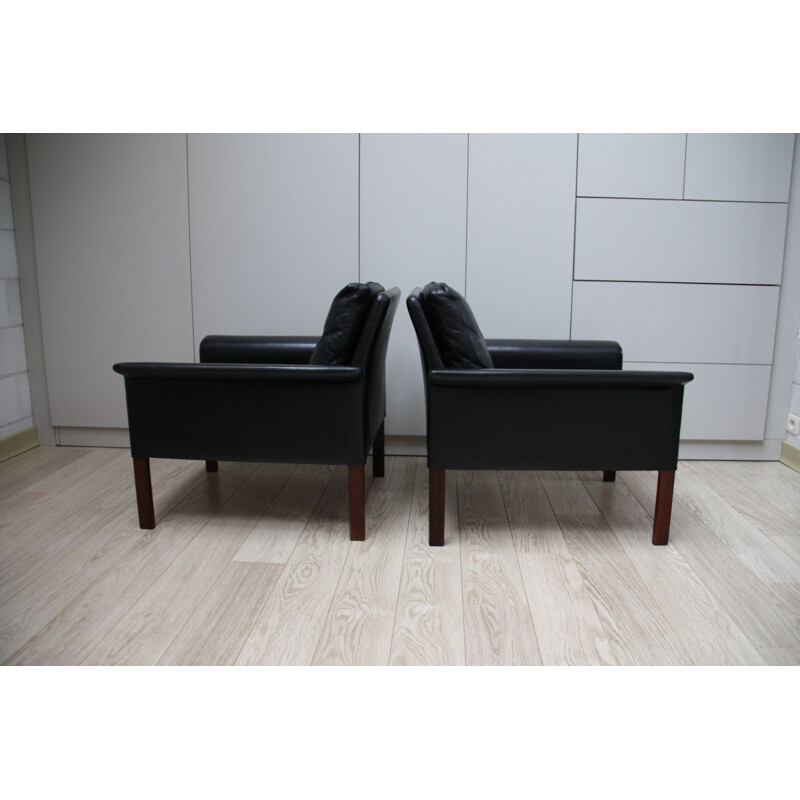 Pair of black leather Club armchairs by Hans Olsen