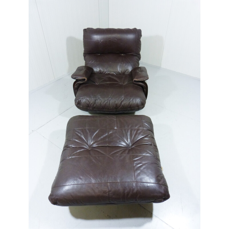 Lounge chair and its ottoman in dark brown leather and plastic, Michel DUCAROY - 1970s