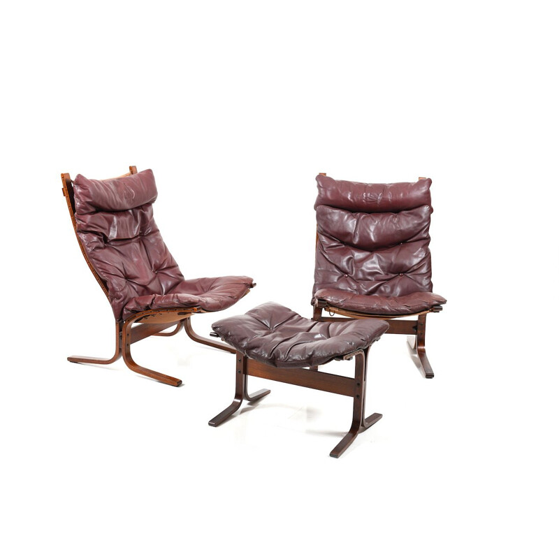 Pair of burgundy lounge chairs by Ingmar Relling