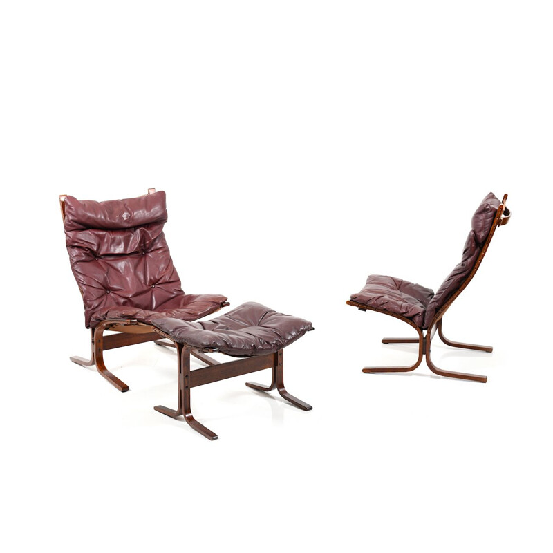 Pair of burgundy lounge chairs by Ingmar Relling