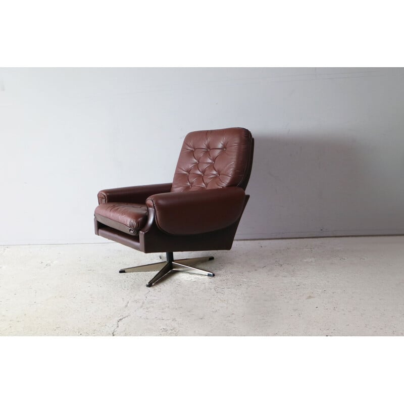 Danish swiveling armchair in brown leather