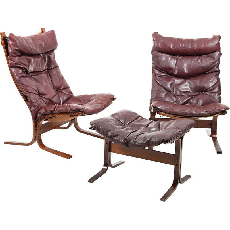 Paire de fauteuils en cuir bordeaux par Ingmar Relling