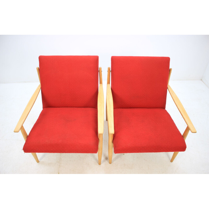 Pair of vintage armchairs in red fabric and oak, Czech 1960