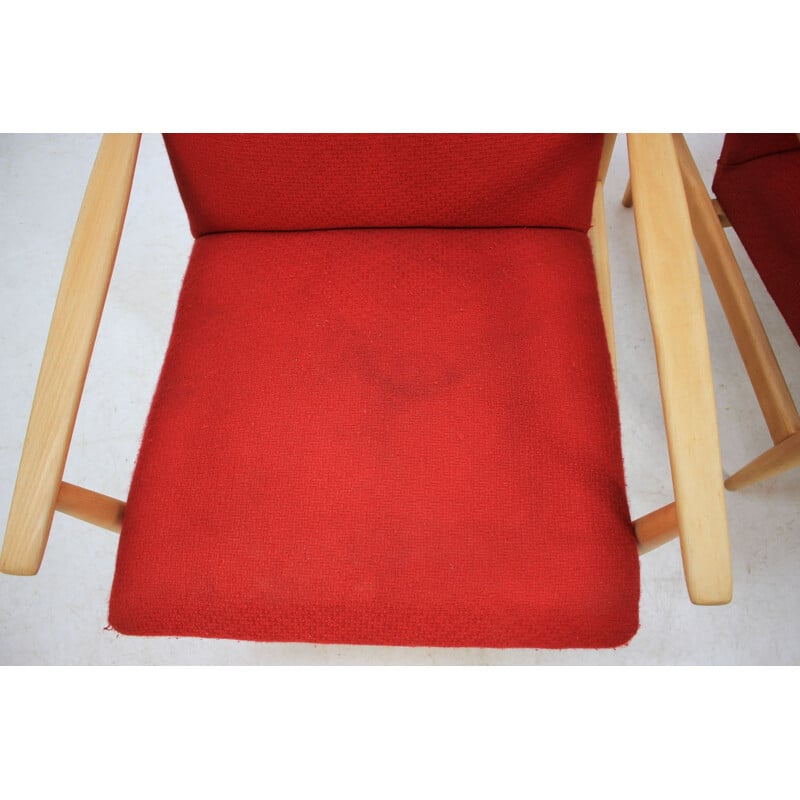 Pair of vintage armchairs in red fabric and oak, Czech 1960