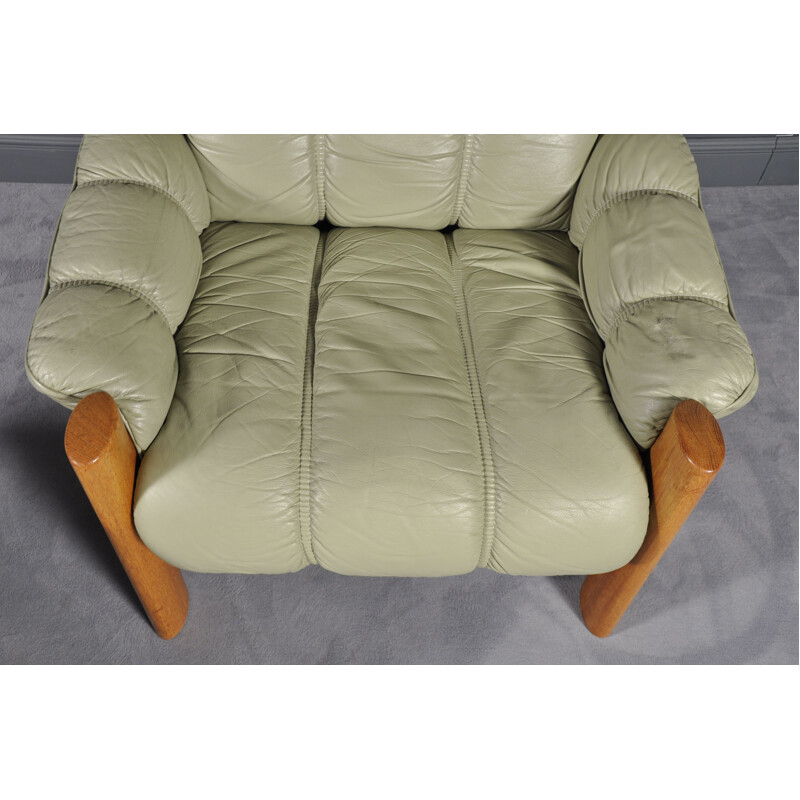 Vintage Montana green leather armchair with its footrest 1970