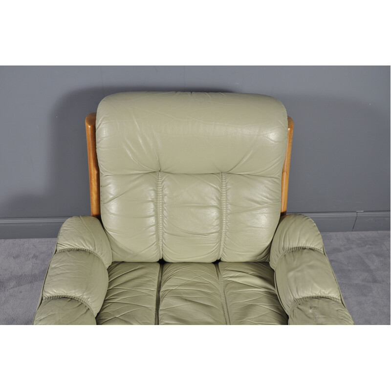 Vintage Montana green leather armchair with its footrest 1970
