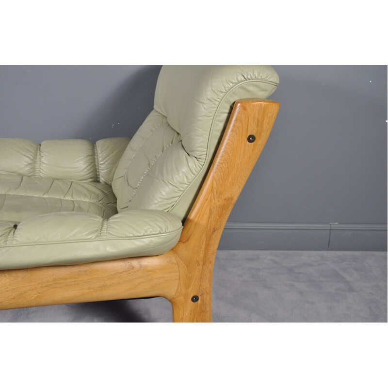 Vintage Montana green leather armchair with its footrest 1970