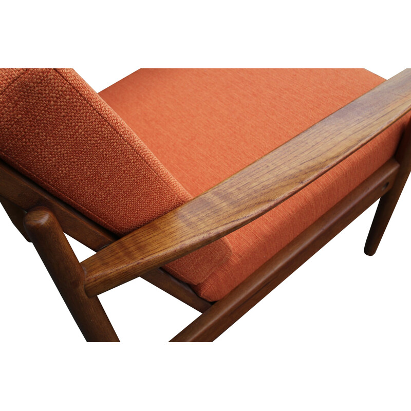 Vintage orange armchair in teak